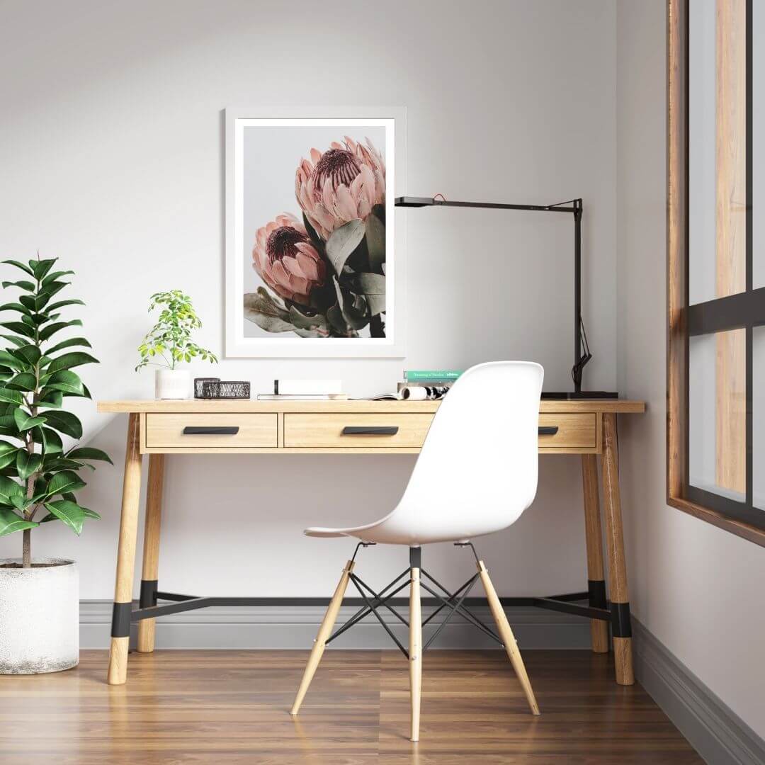 The wall art photo print of a peach protea floral b with a white frame to decorate your kids bedroom walls