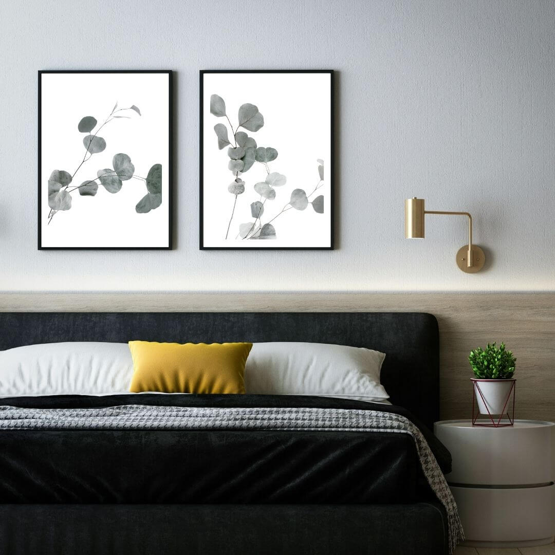 A set of 2 Australian Native Eucalyptus Leaves Wall Art Prints with a black frame, no border on bedoom wall