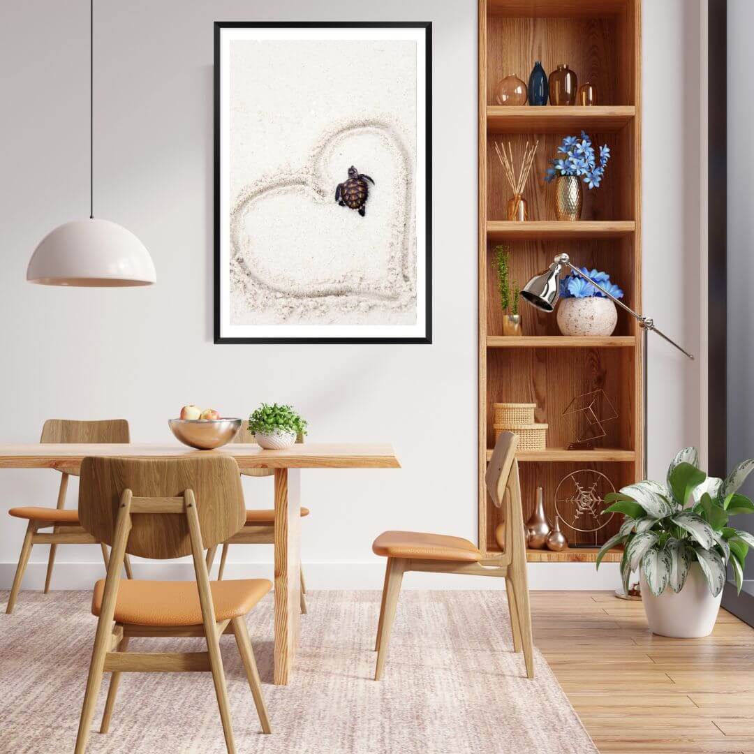 A wall art photo print of a turtle on the beach with a black frame or unframed to style your dining room walls