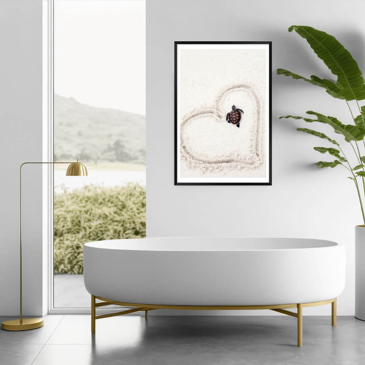 A wall art photo print of a turtle on the beach with a black frame or unframed for your bathroom
