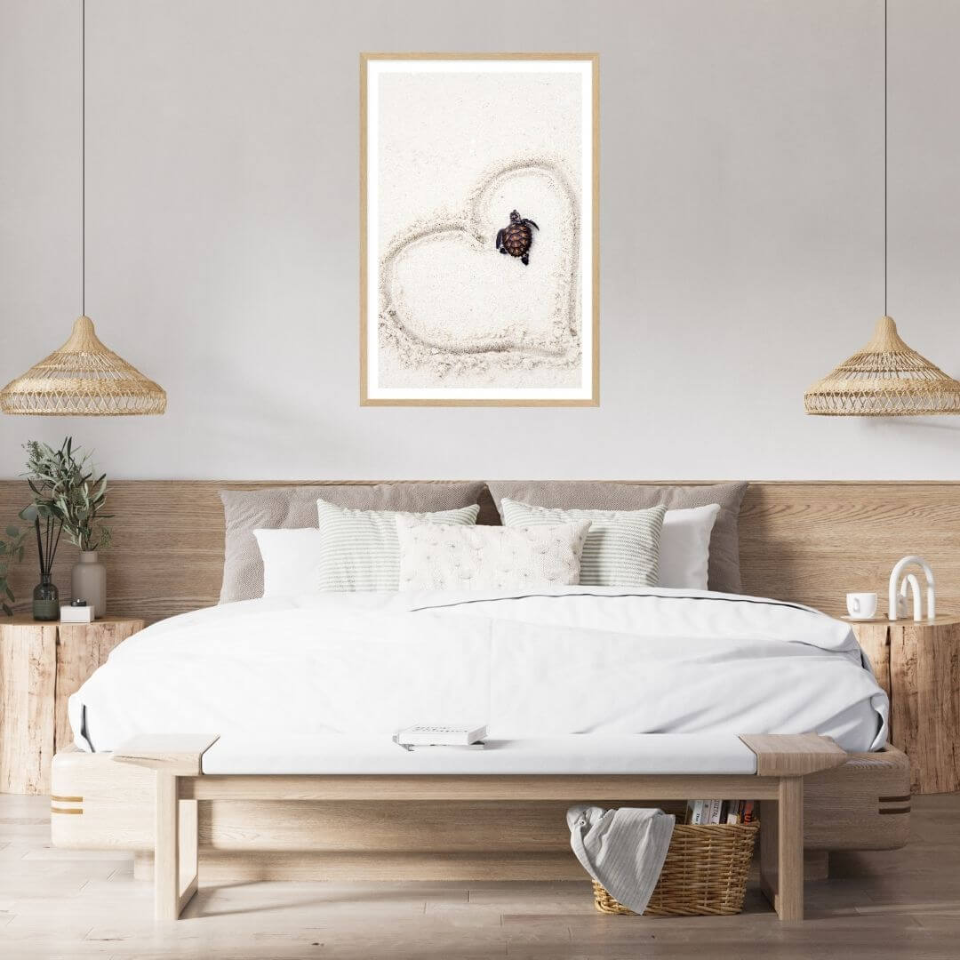 A wall art photo print of a turtle on the beach with a timber frame to decorate your bedroom walls