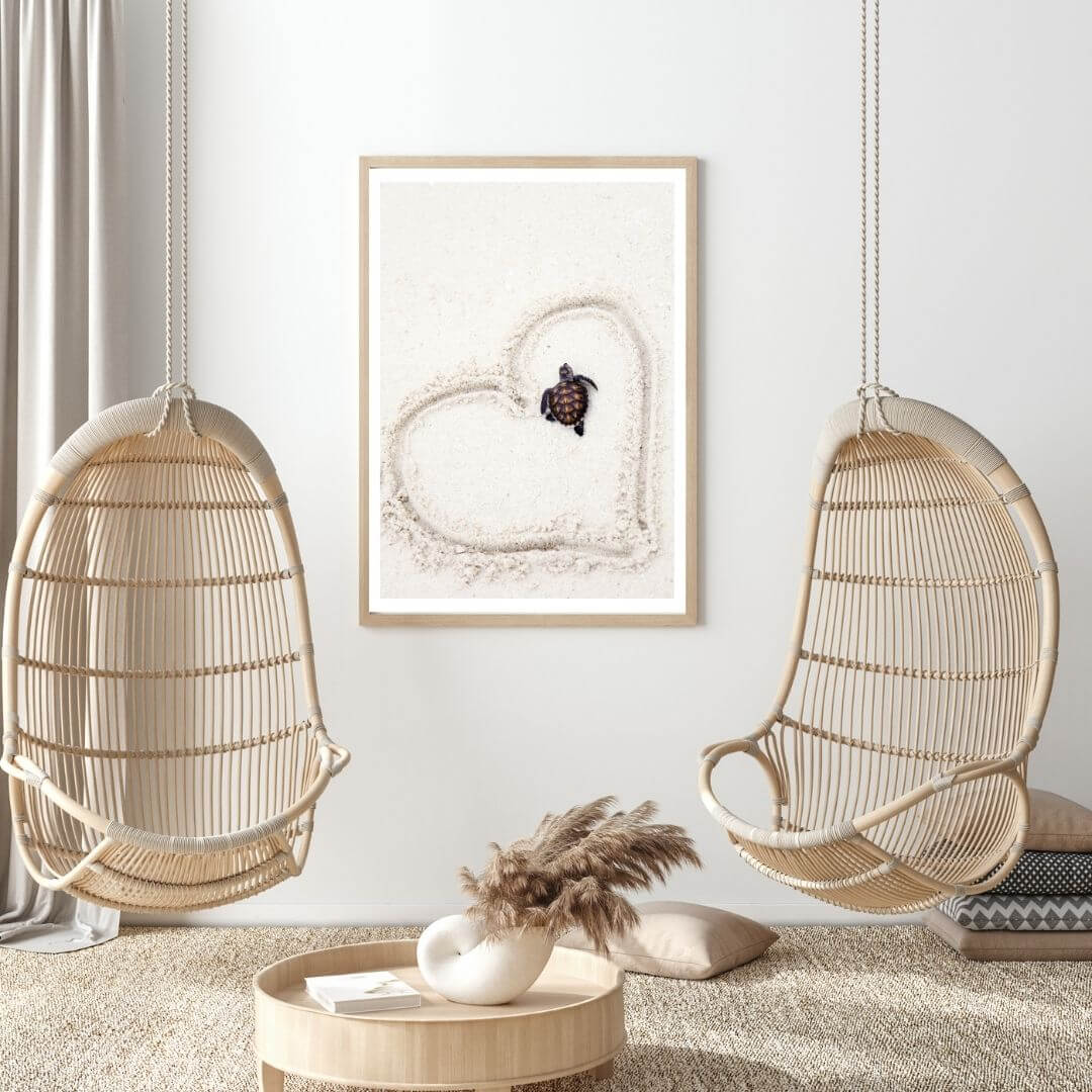 A coastal wall art photo print of a heart around a turtle on the beach with a timber frame or unframed for your living room empty walls