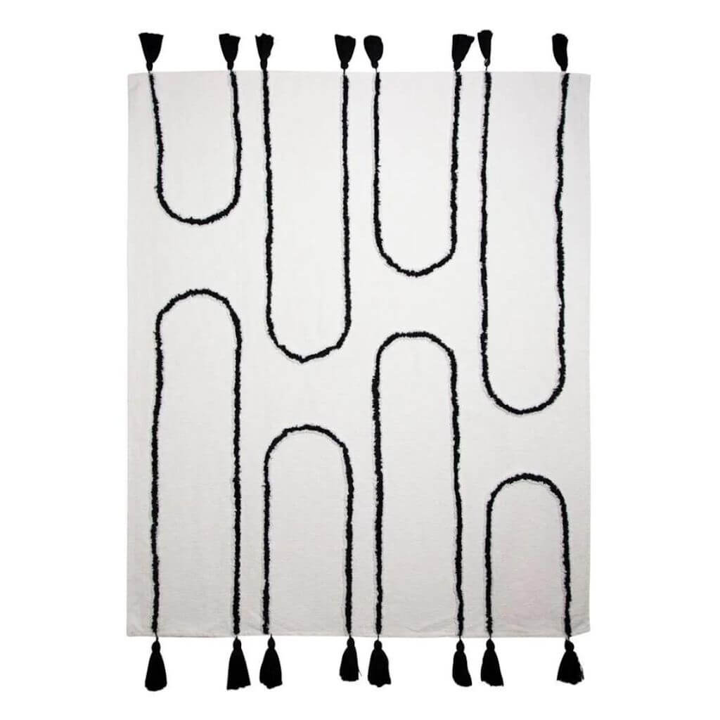 The Black U-shaped pattern and tassels on a Ivory White Waverley Throw measures 130cm x 160cm, the perfect throw to style your bed or sofa.