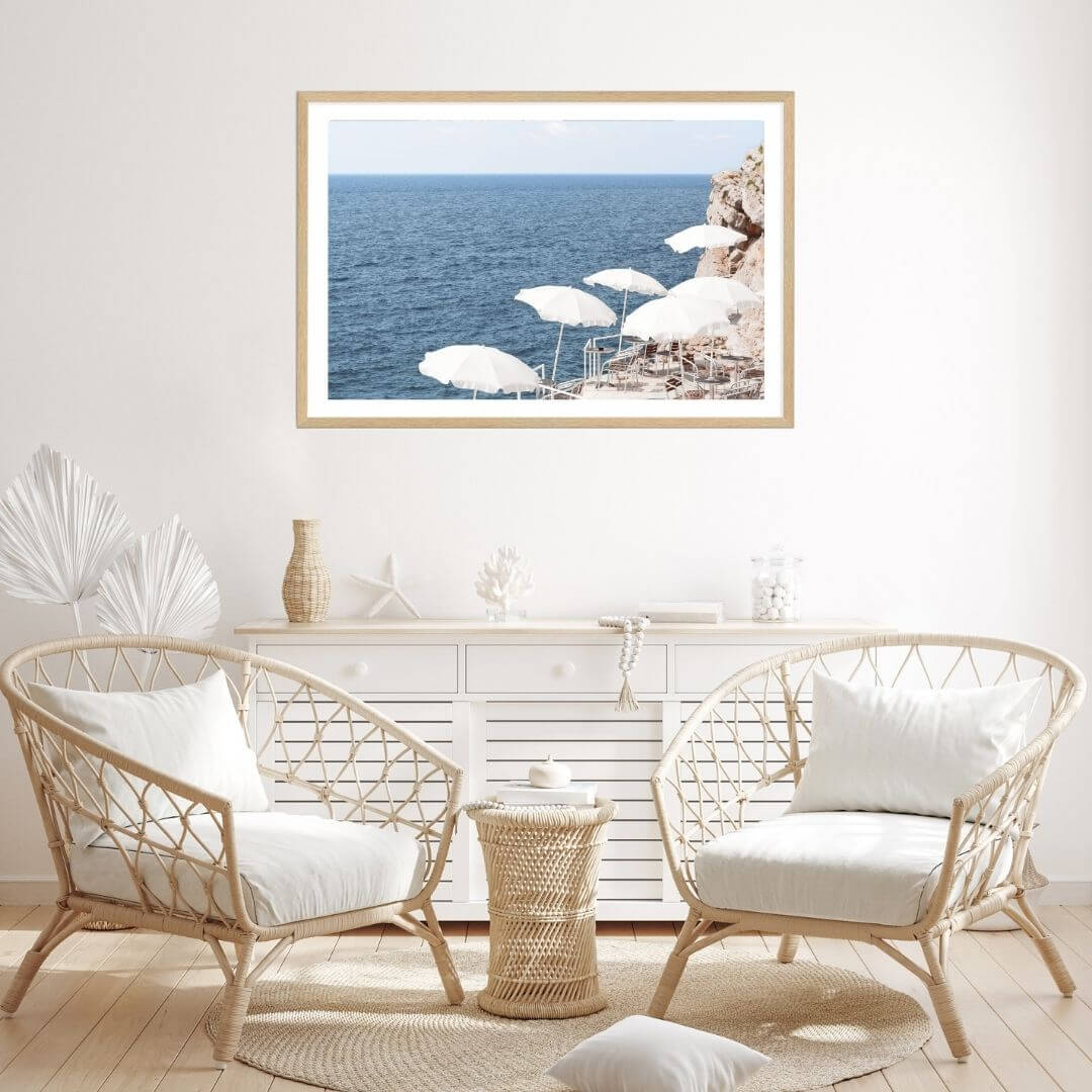 A coastal wall art photo print of white umbrellas on an Amalfi Coast Beach Italy with a timber frame for the living room by Beautiful Home Decor
