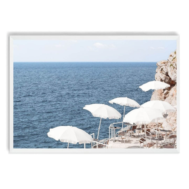 A wall art photo print of white umbrellas on an Amalffi Coast Beach Italy with a white frame, no white border at Beautiful HomeDecor
