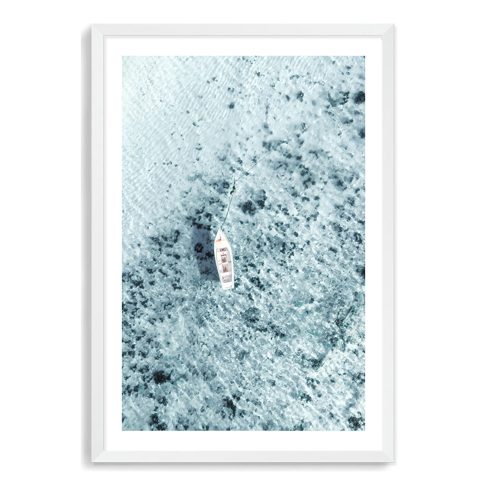 Available framed or unframed this coastal wall art print is of a white boat on the clear blue ocean waters, taken off the Amalfi Coast in Italy