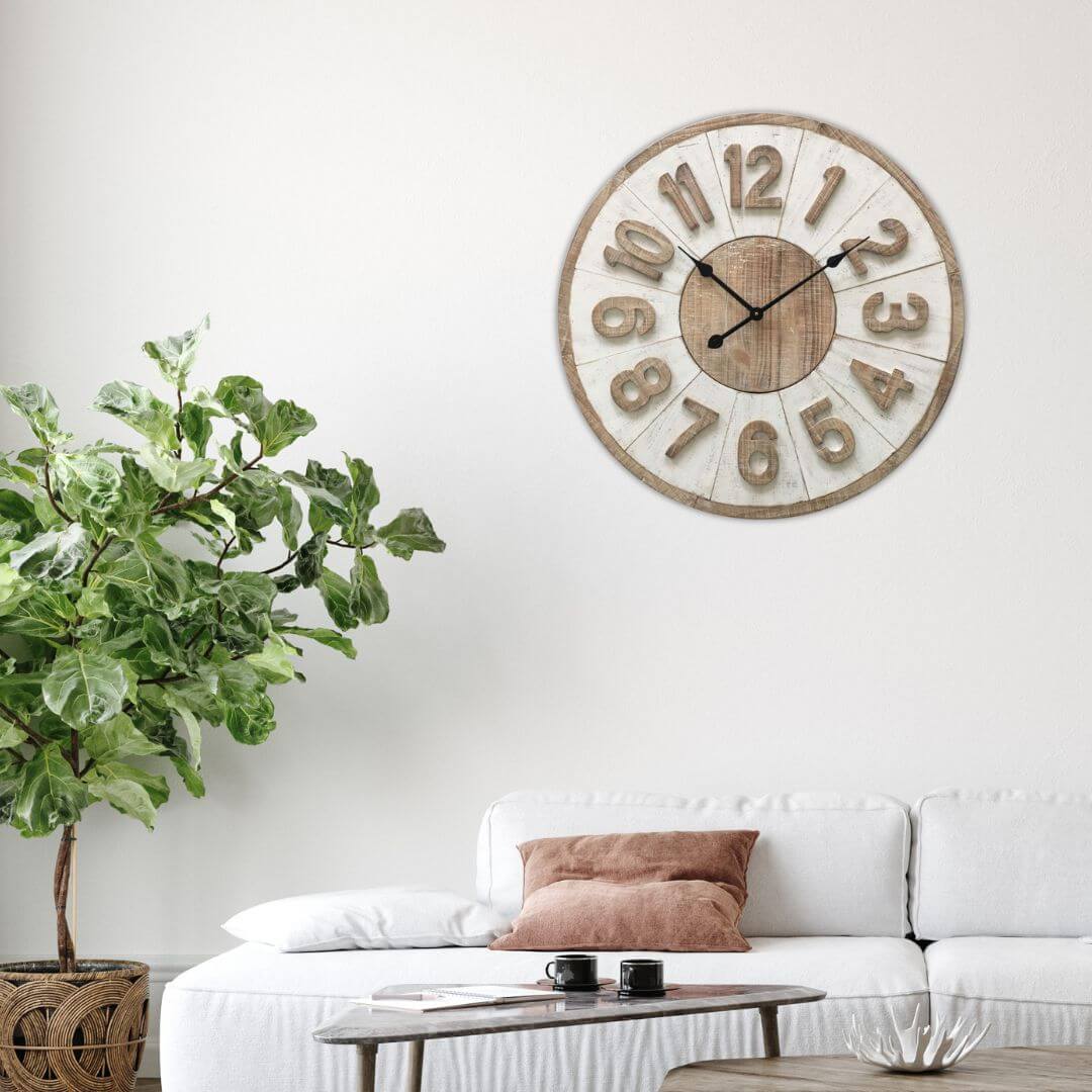 Living room with a large 70cm Hamptons Giro wall clock, white sofa, and decorative items.