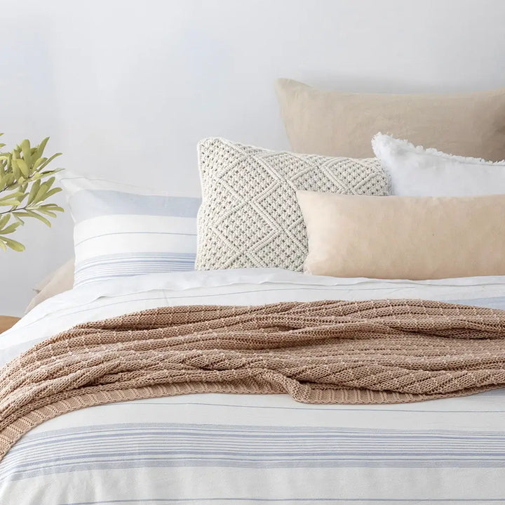 Anka Ivory Macrame cushion on bed from Beautiful Home Decor