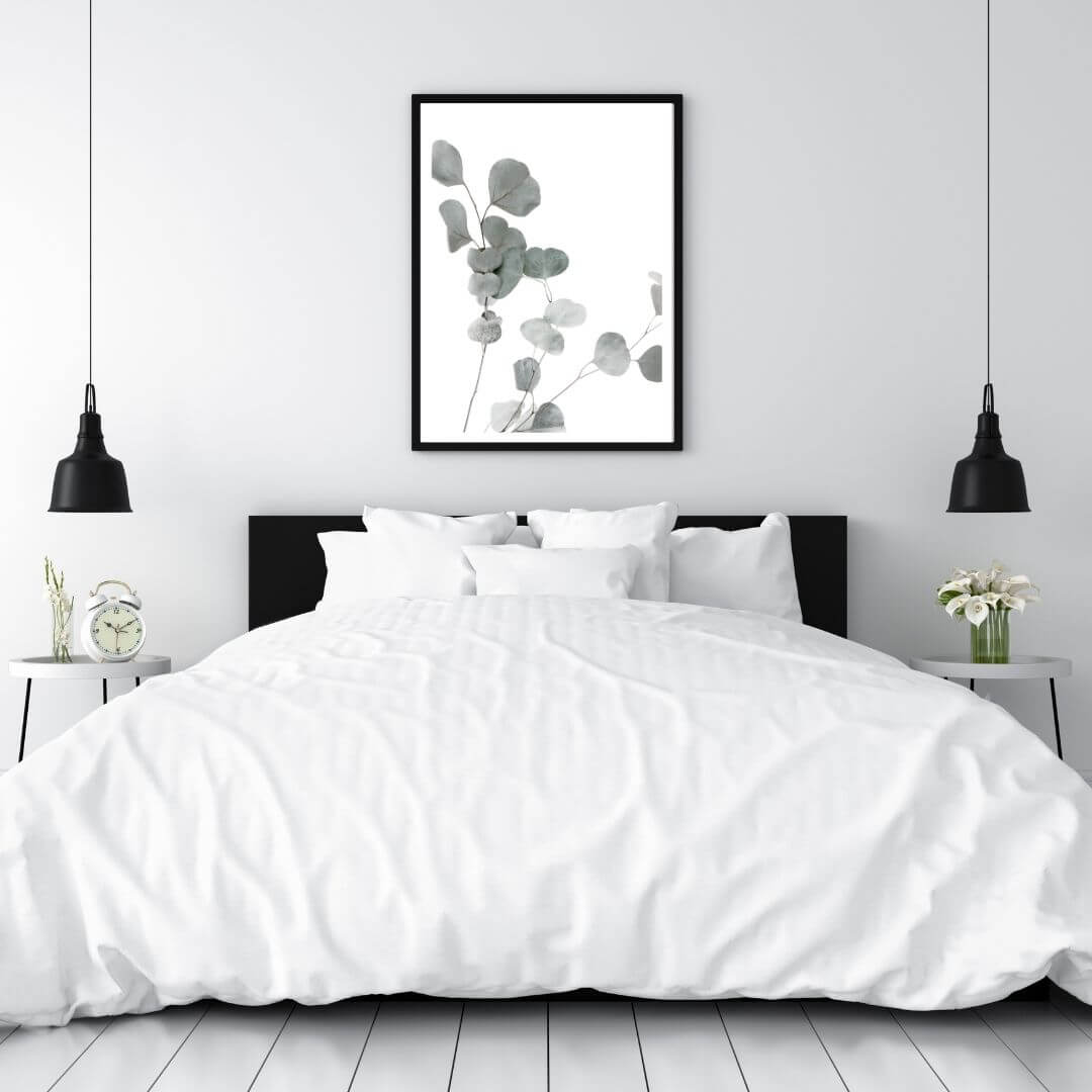 A wall art photo print of an Australian native eucalyptus leaves A with a black frame for the wall in your bedroom