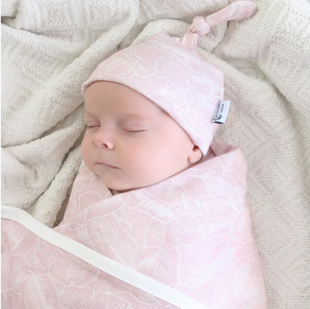 Anchor and Arrow baby swaddle wrap and beanie set in Pink Palm, soft jersey cotton for  comfort.