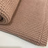 A lusciously soft Cable Knitted Baby Blanket from Mini and Me in beautiful Blush Pink to keep your baby warm