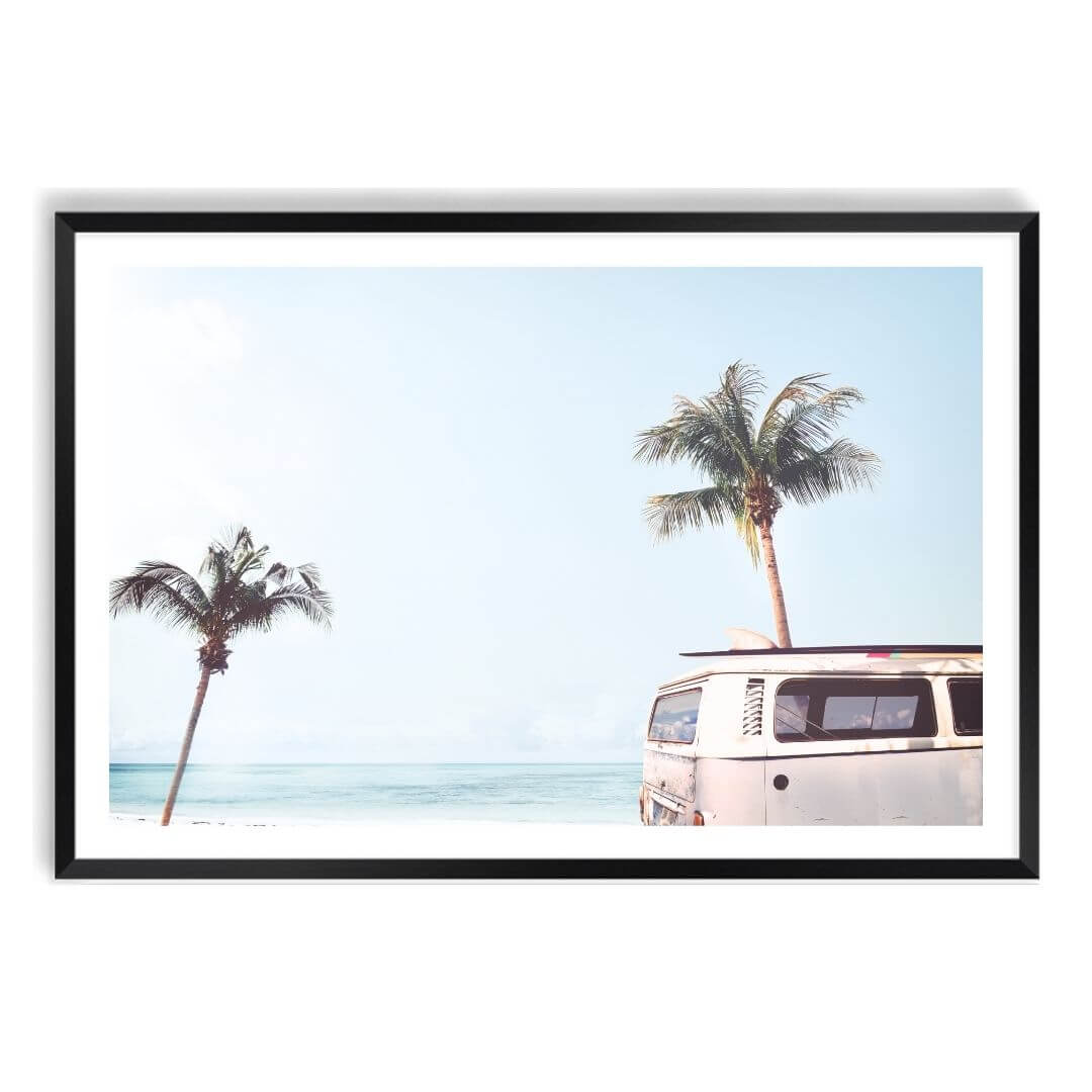 A wall art photo print of a blue beachside kombi van with a black frame, white border by Beautiful Home Decor