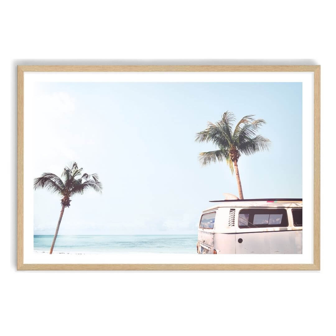A wall art photo print of a blue beachside kombi van with a timber frame, white border by Beautiful Home Decor