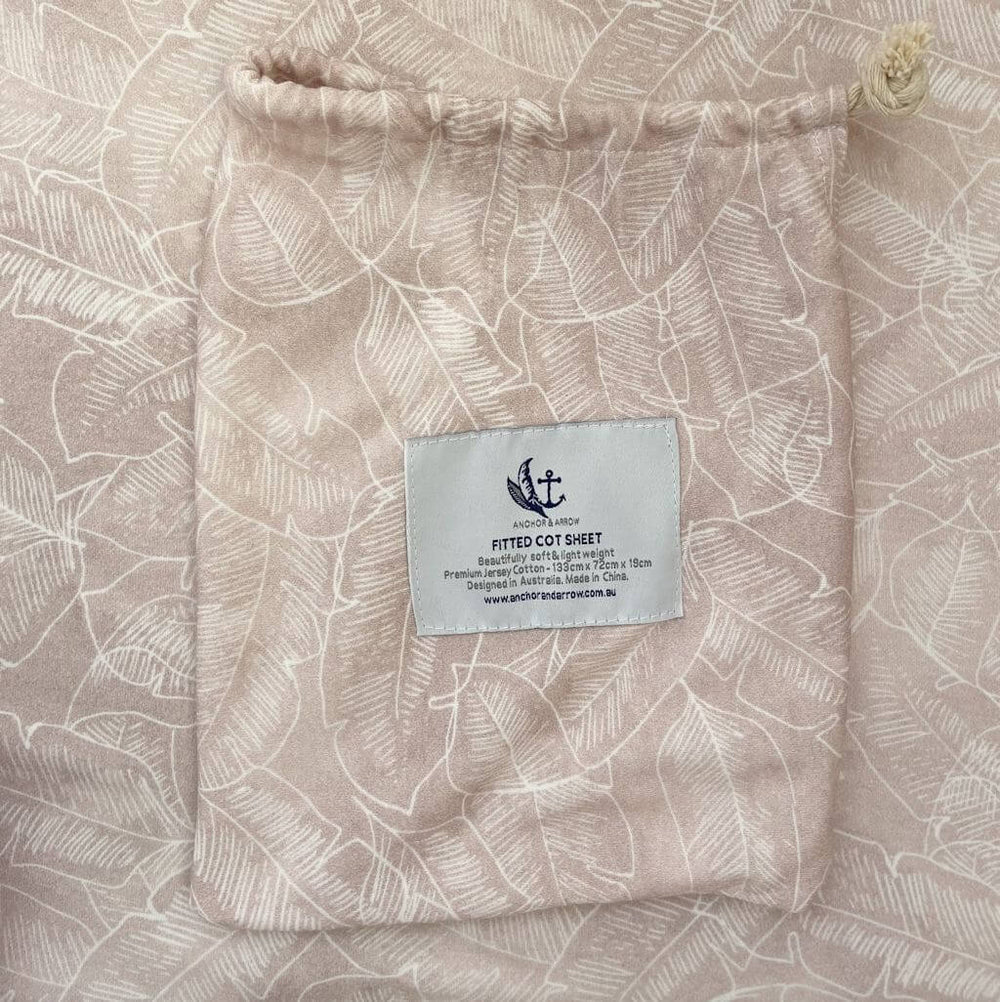 A breathable Jersey Cotton Fitted Baby Cot Sheet in a beautiful Palm Pink design.