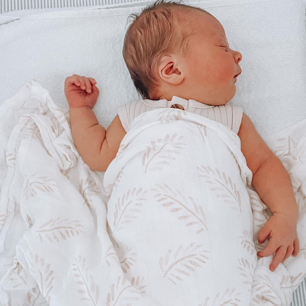 Keep your baby cool and comfortable with a 100% Organic Bamboo Cotton Swaddle in a natural Gold Fern style