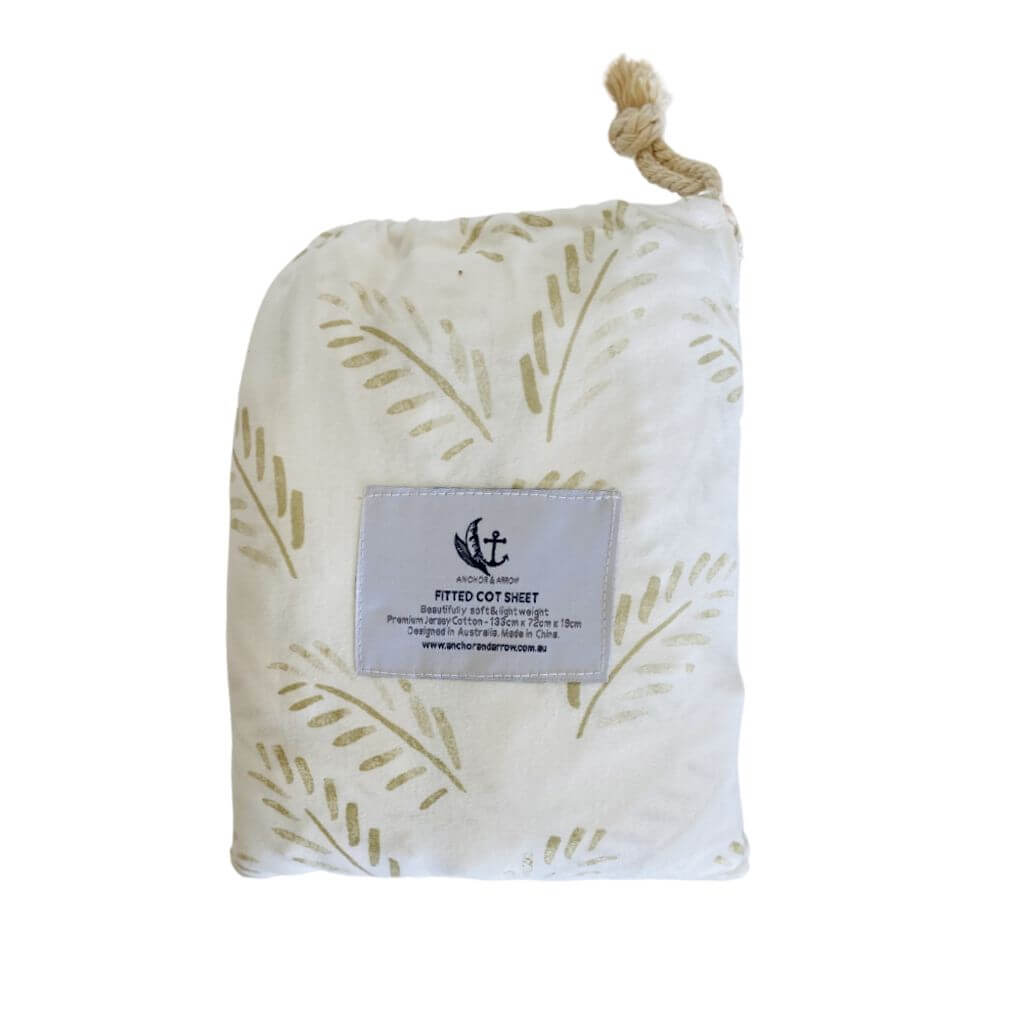 A super soft and light weight Jersey Cotton Baby Cot Sheet in a beautiful Gold Fern pattern