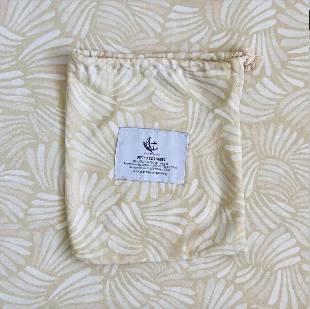 A super soft and breathable  Jersey Cotton Baby Cot Sheet in a cute coastal Sandy Shell design.