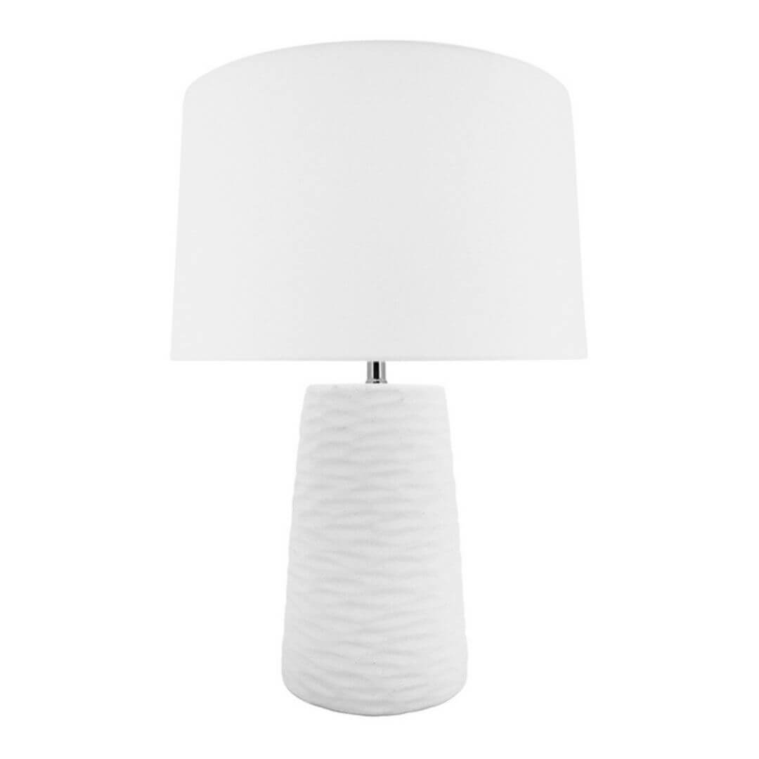 The 62cm tall white Kima Table lamp has a textured wavy base and white lamp shade , perfect for your coastal Hamptons home decor.