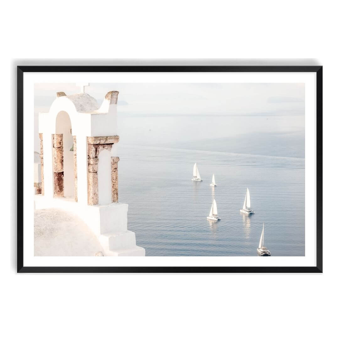 A wall art photo print of Boats sailing on the sea in Santorini Greece  with a black frame, white border by Beautiful Home Decor