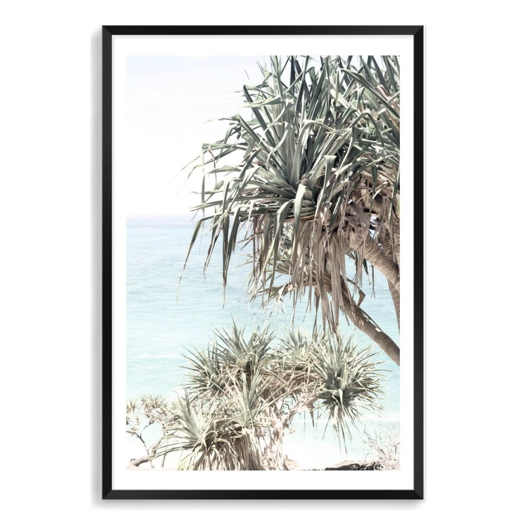 A wall art photo print of the Byron Bay Beach Sea View with a black frame, white border by Beautiful Home Decor
