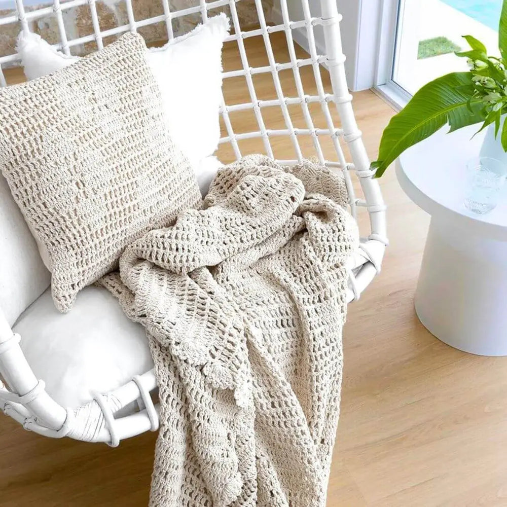 Callista ivory crochet throw and cushion set on a chair