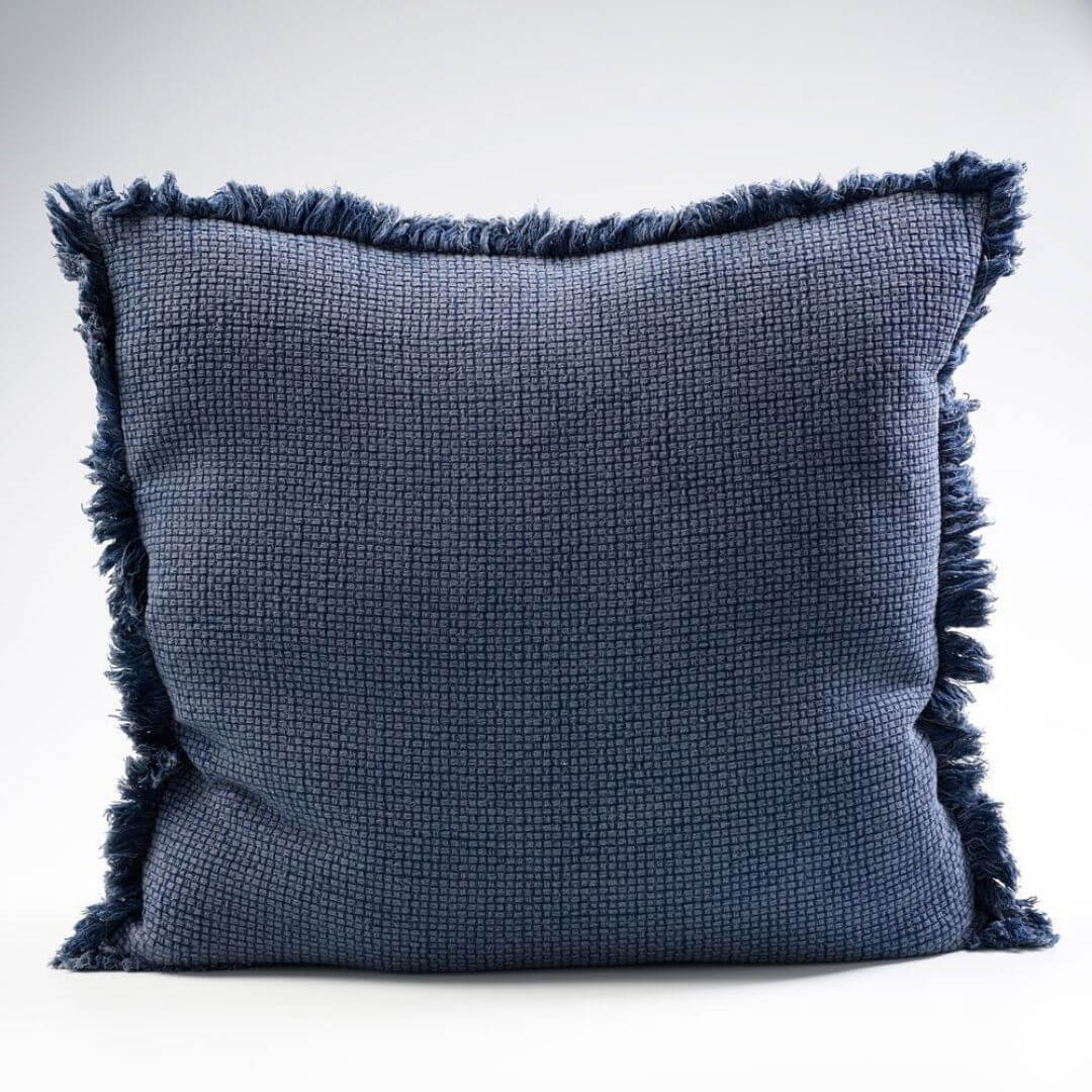A Square 60cm Chelsea Fringe Cotton Cushion in navy blue.