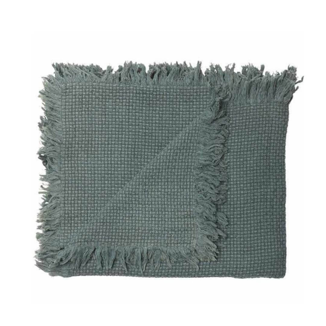 A beautiful khaki green throw part of the Square 50cm Chelsea Fringe Cotton Cushion and Throw Bundle Set