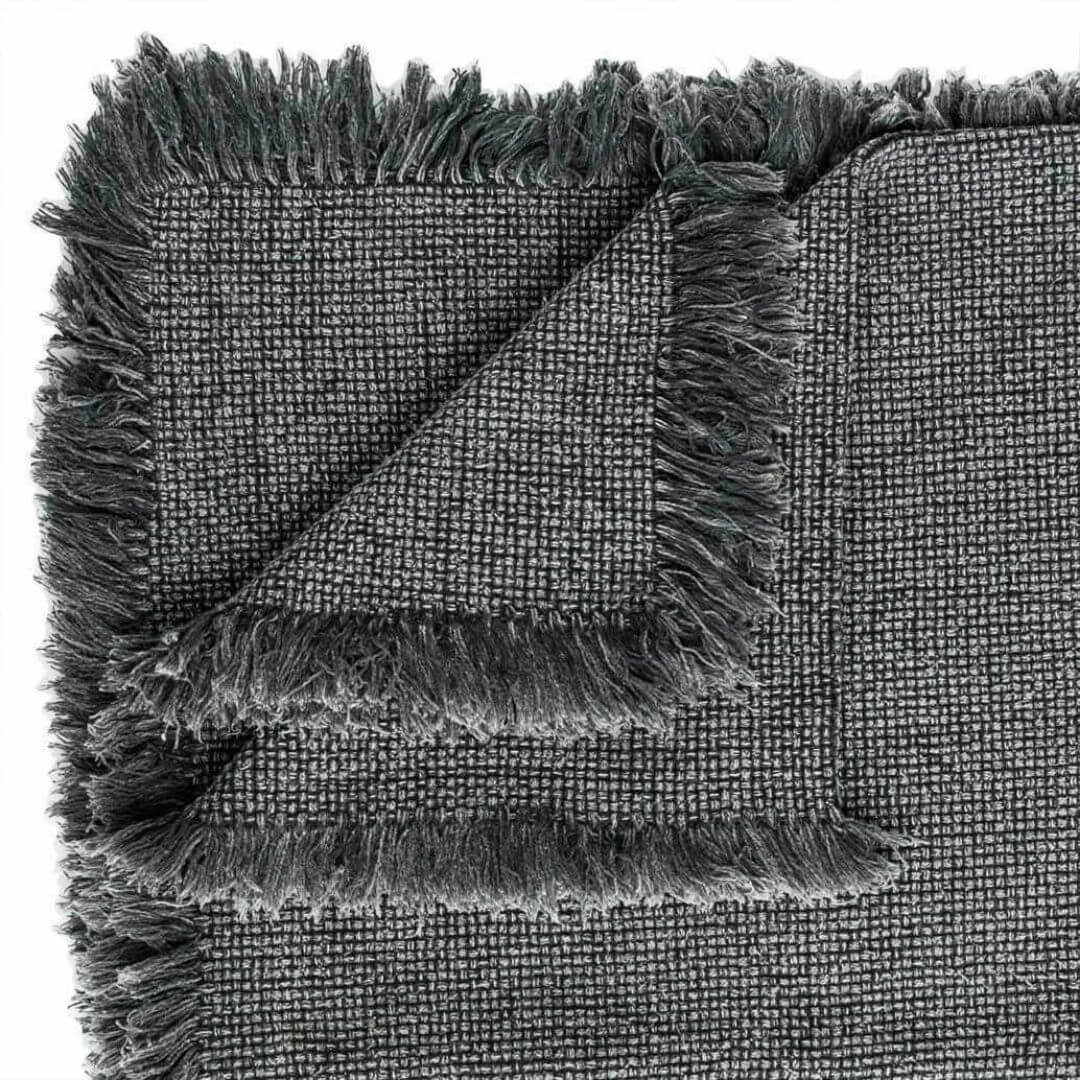 The Chelsea Cotton Throw with fringe measuring 150cm x 180cm in slate grey.