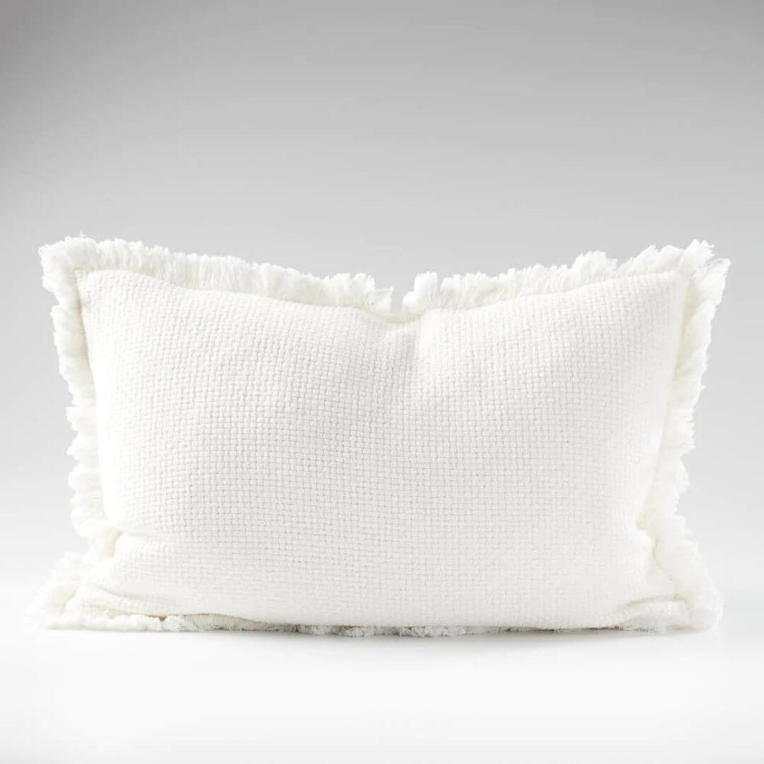 An off white Rectangle 40cm x 60cm Chelsea Fringe Cotton Cushion with a throw for your Coastal Hamptons Australian home decor.