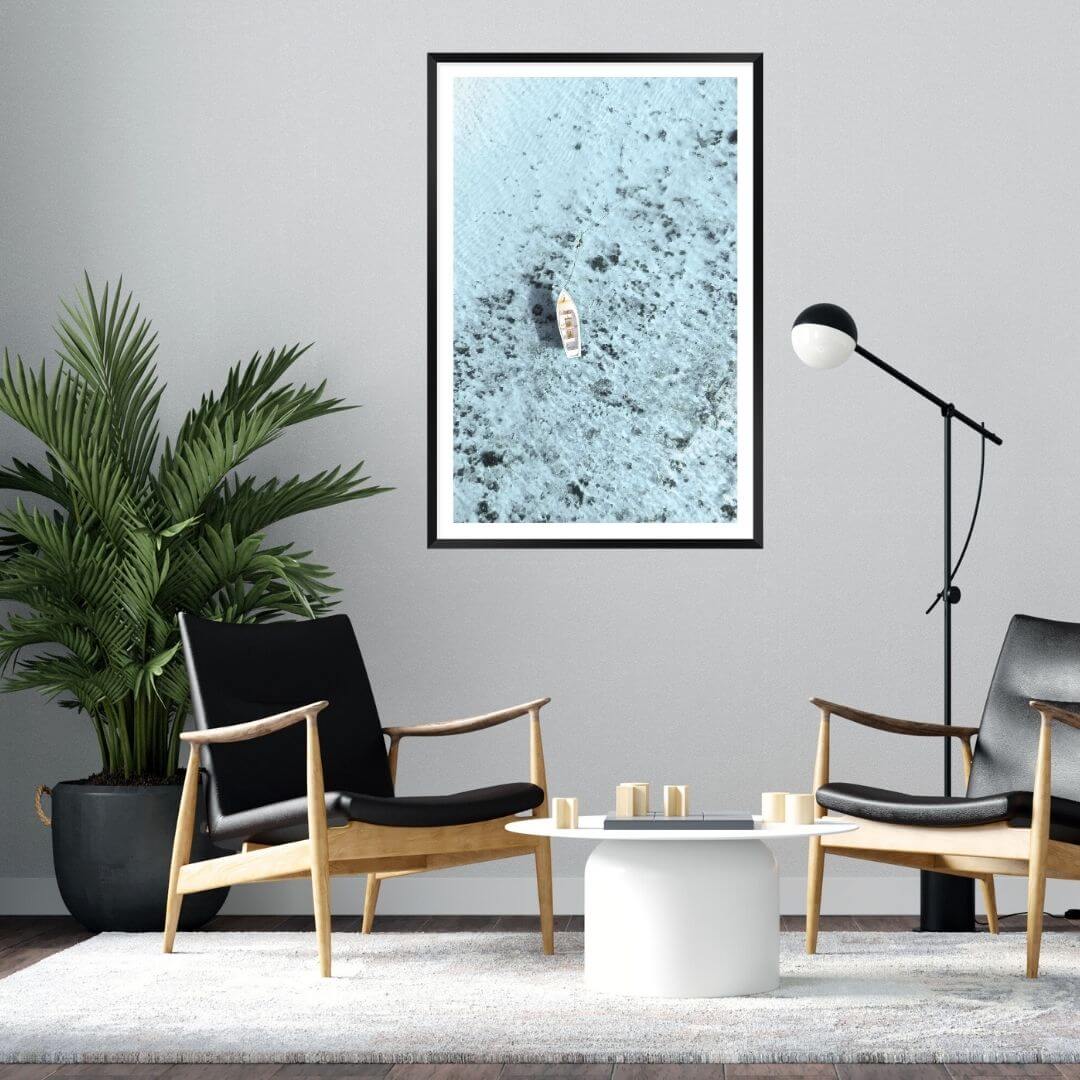 A wall art photo print of a white boat on a clear blue ocean off the Amalfi Coast Italy with a black frame or unframed to decorate a wall in your coastal living room