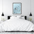 A wall art photo print of a white boat on a clear blue ocean off the Amalfi Coast Italy with a black frame for the wall in your bedroom