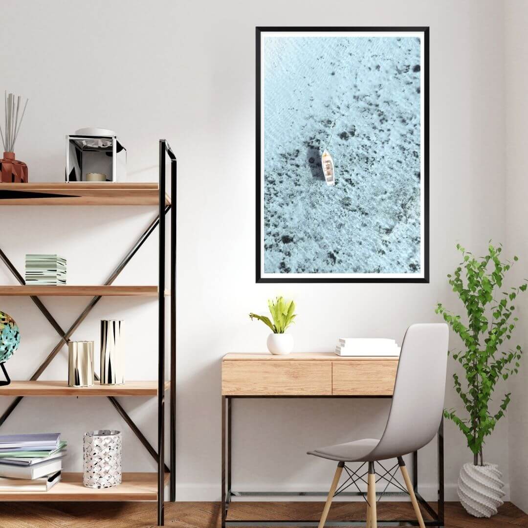 A wall art photo print of a white boat on a clear blue ocean off the Amalfi Coast Italy with a black frame or unframed for your office study wall