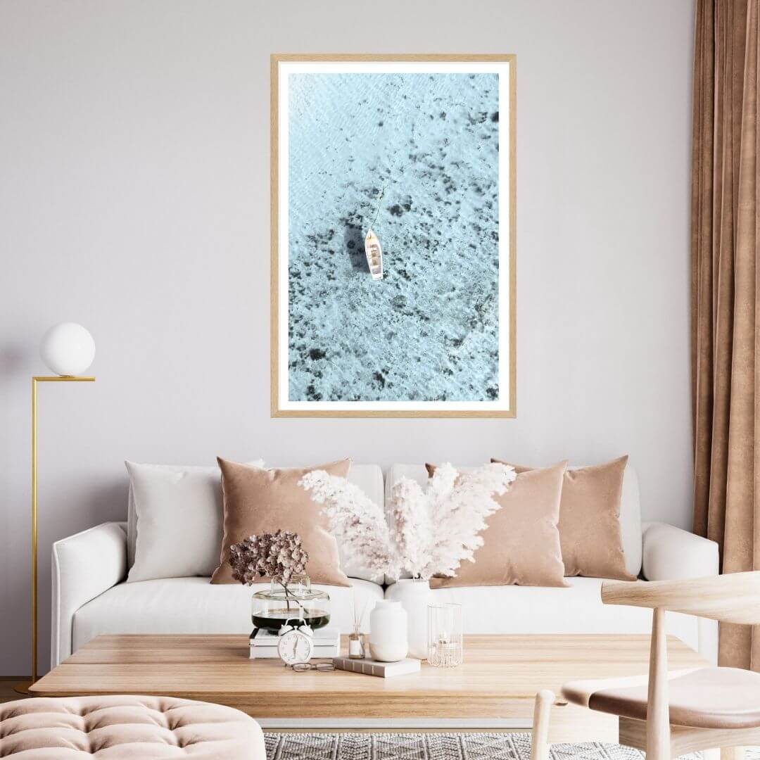 A wall art photo print of a white boat on a clear blue ocean off the Amalfi Coast Italy with a timber frame for the living room by Beautiful Home Decor