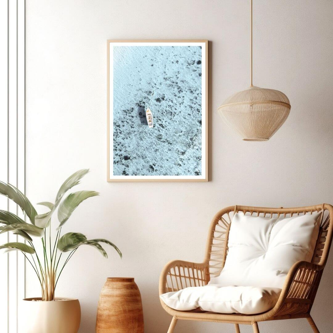 A coastal wall art photo print of a white boat on a clear blue ocean off the Amalfi Coast Italy with a timber frame or unframed to decorate walls in living room