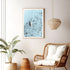 A coastal wall art photo print of a white boat on a clear blue ocean off the Amalfi Coast Italy with a timber frame or unframed to decorate walls in living room