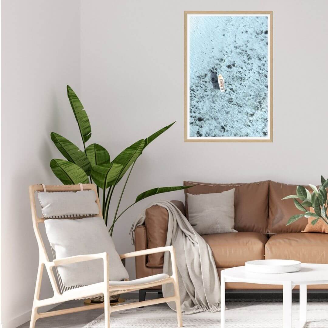 A wall art photo print of a white boat on a clear blue ocean off the Amalfi Coast Italy with a timber frame or unframed to decorate an empty wall in your home