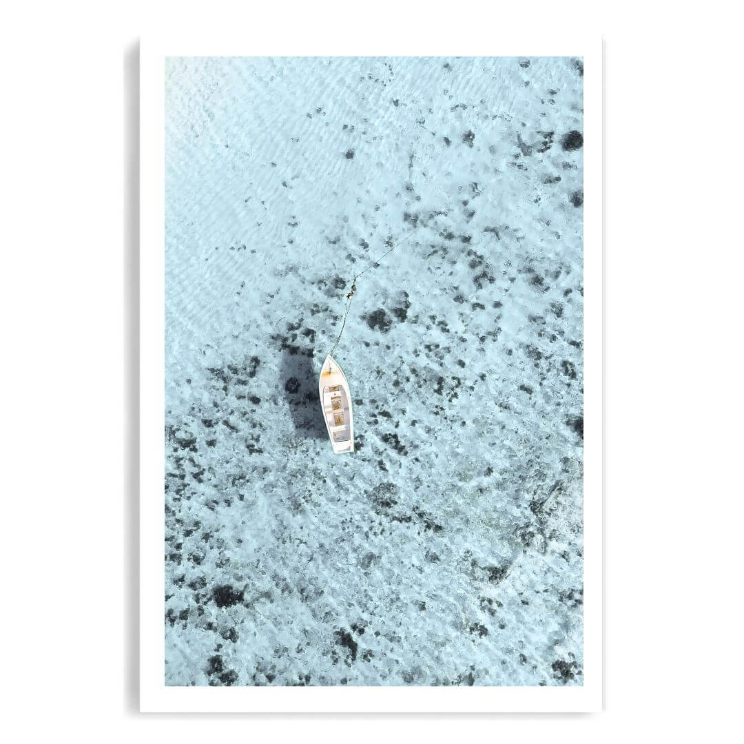 A coastal wall art photo print of a white boat on a clear blue ocean off the Amalfi Coast Italy unframed with a white border by Beautiful Home Decor