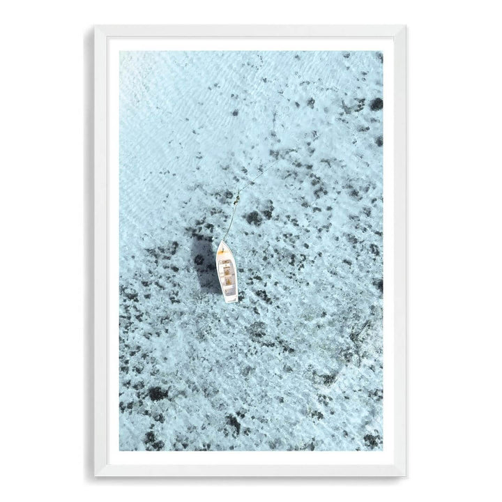 A wall art photo print of a white boat on a clear blue ocean off the Amalfi Coast Italy with a white frame, white border by Beautiful Home Decor