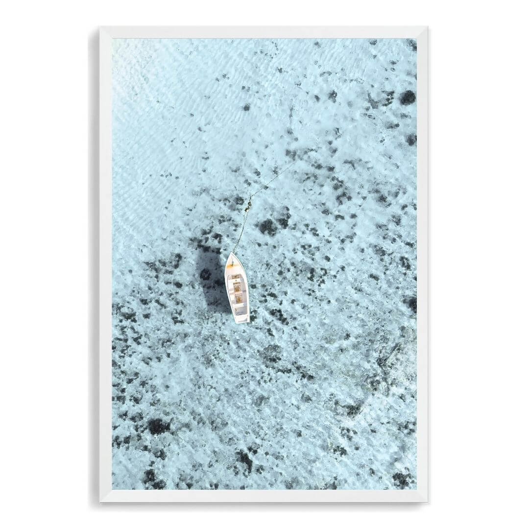 A wall art photo print of a white boat on a clear blue ocean off the Amalfi Coast Italy with a white frame, no white border at Beautiful Home Decor