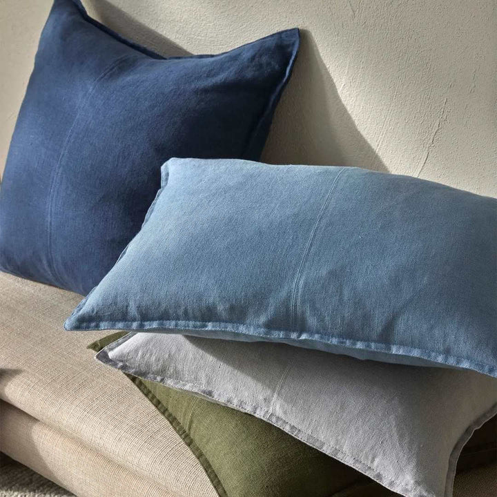 Blue, green and grey como square and rectangle lumbar linen cushions on a bench