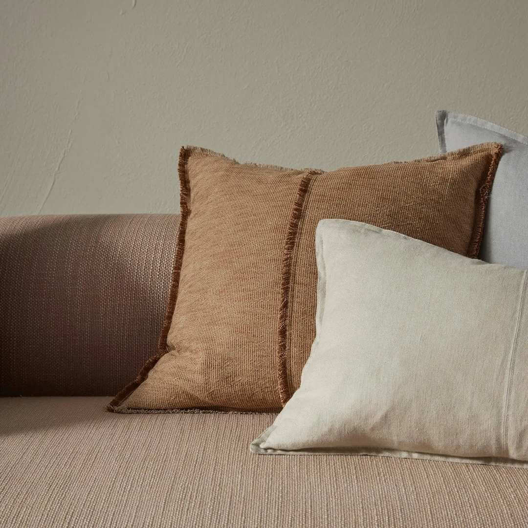 Como Square and Rectangle Lumbar cushion styled alongside a brown cushion on a sofa