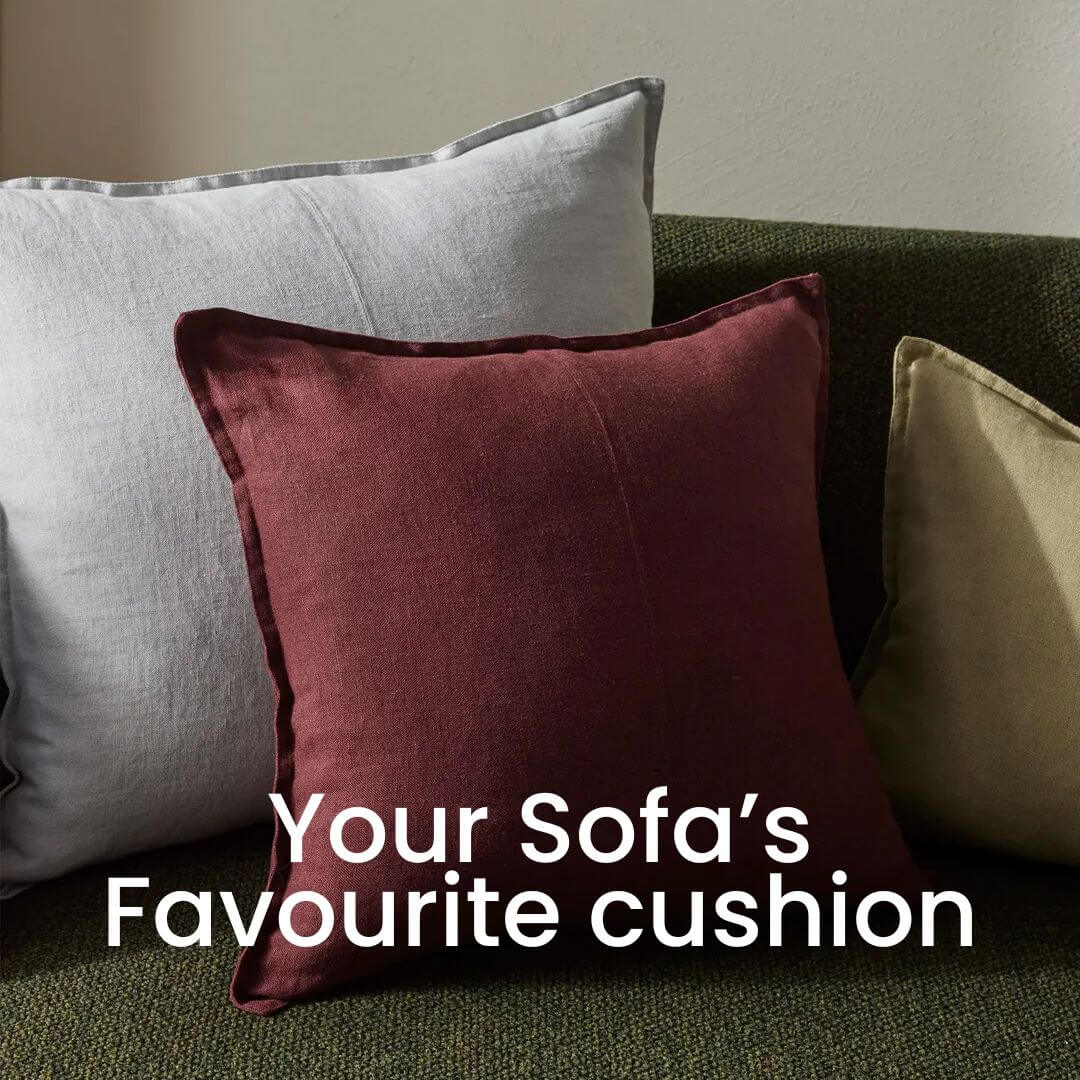 50cm, 6cm and lumbar Como Linen Cushions in red, green and grey on a living room sofa