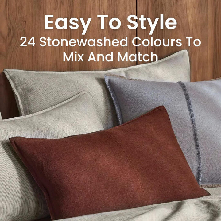 Como Red brown Lumbar rectangle linen cushion on a bed 