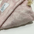 A super soft breathable Jersey Cotton Baby Cot Sheet in a pretty Palm Pink design. 