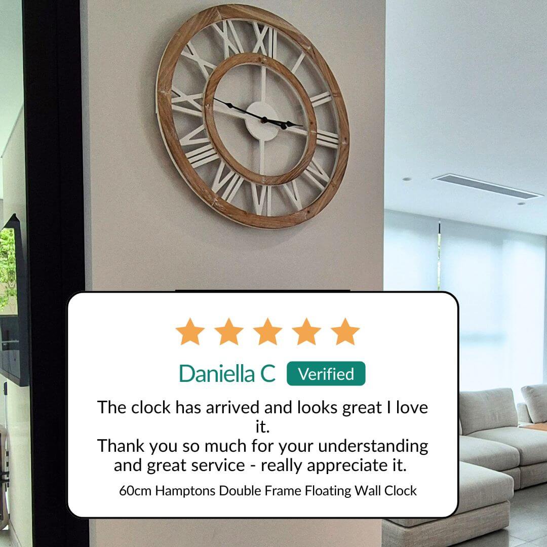 60cm Coastal Hamptons wall clock on a wall with a five-star review from Daniella 