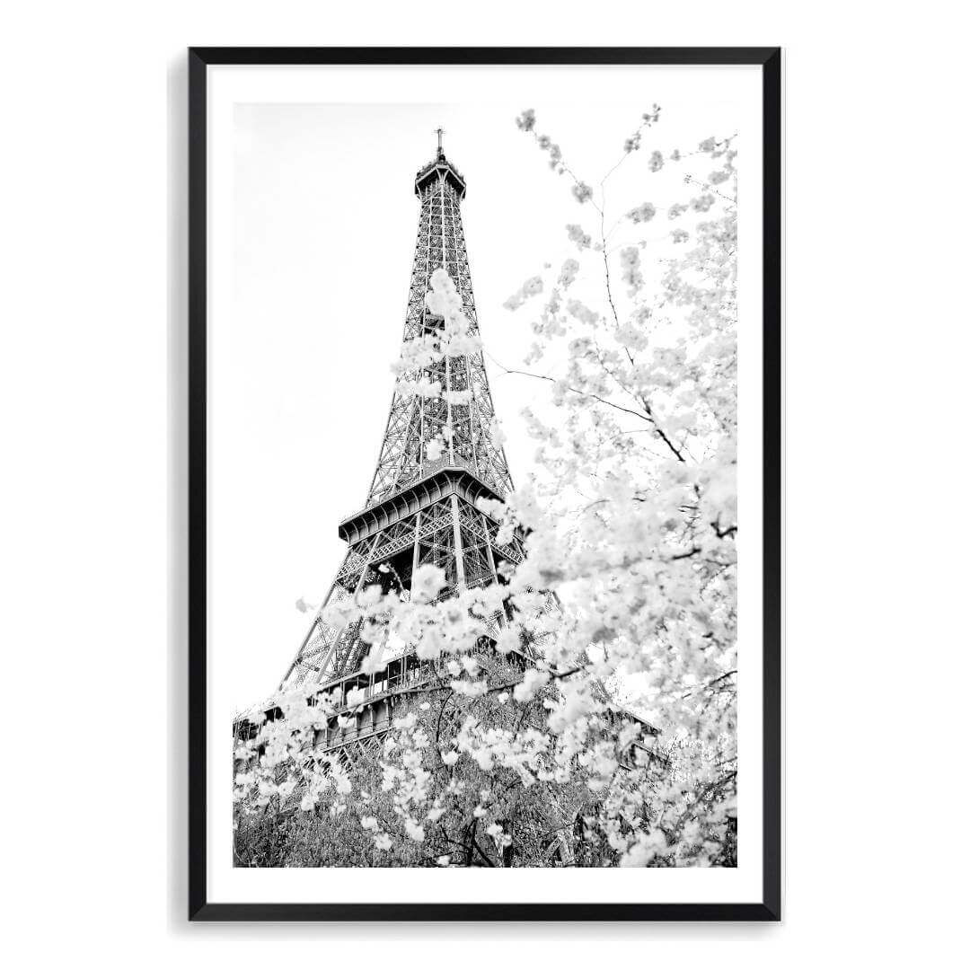 A black and white wall art photo print of the Eiffel Tower in Spring with a black frame, white border on a bathroom wall