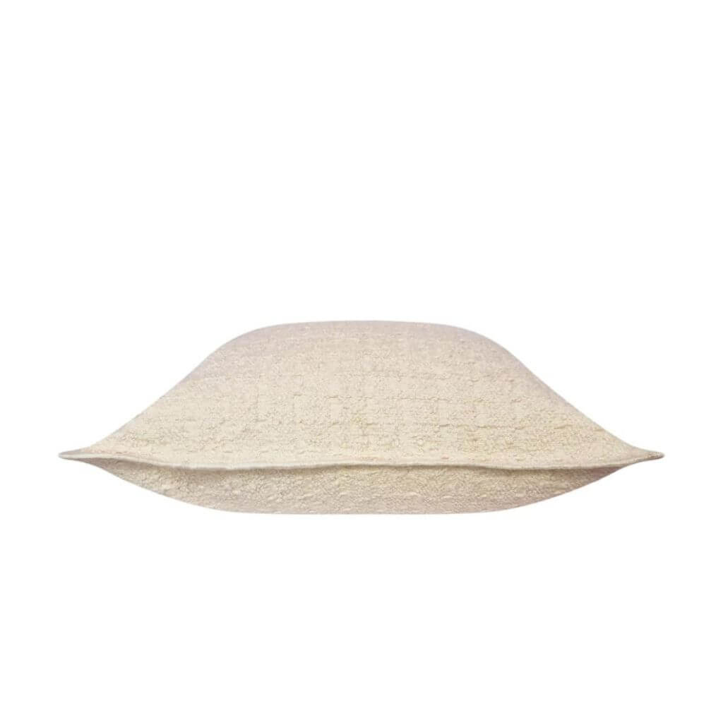 Side view of the Gemma Boucle Square Cream Cushion, measuring 50cm is the perfect decorative cushion to style your bed or sofa.