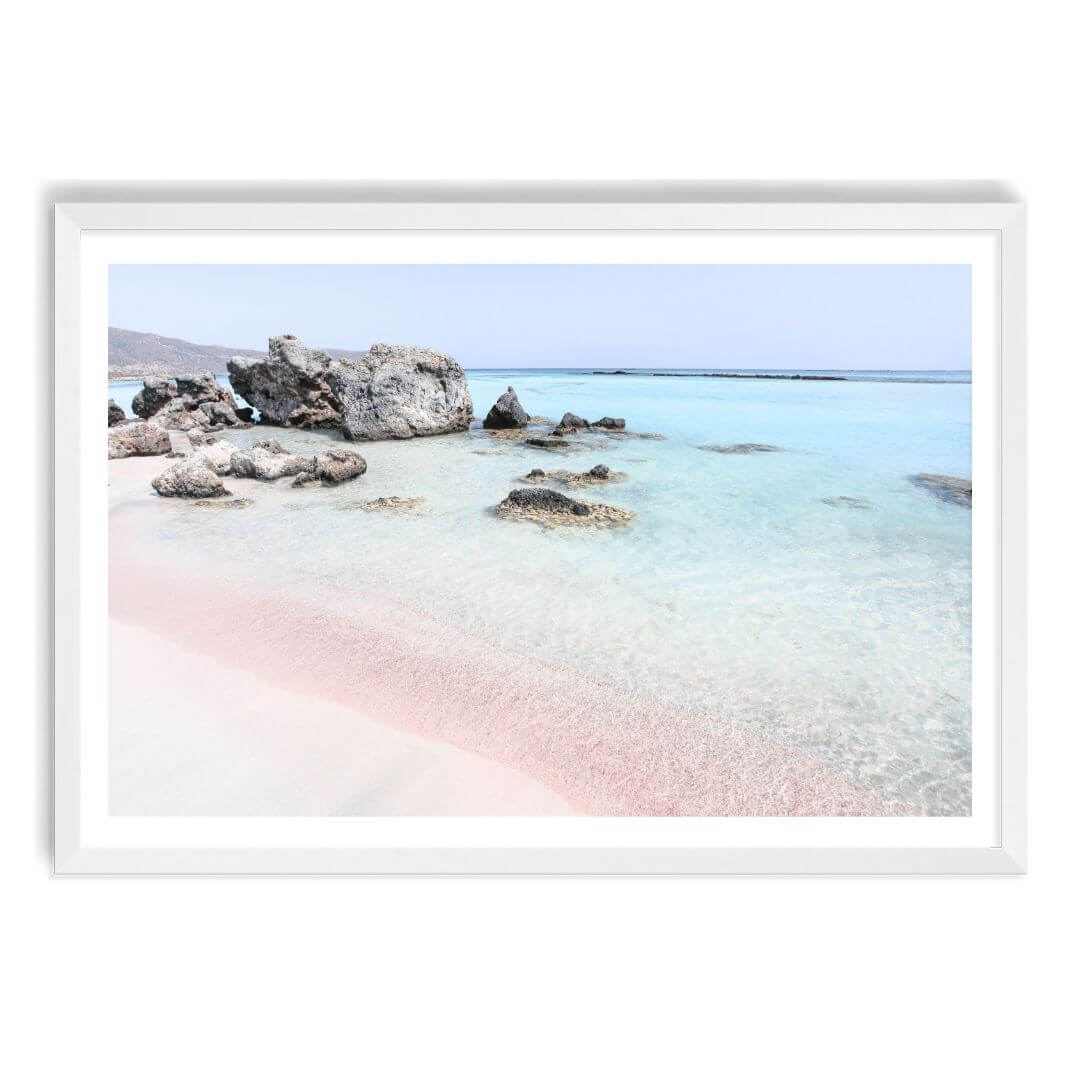 A wall art photo print of a pink beach in Greece with a white frame, white border by Beautiful Home Decor