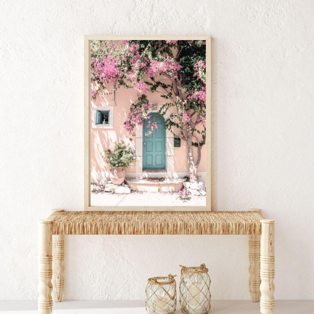 A Greek Pink Villa with Green Door Wall Art Photo Print on a hallway wall entrance by Beautiful Home Decor