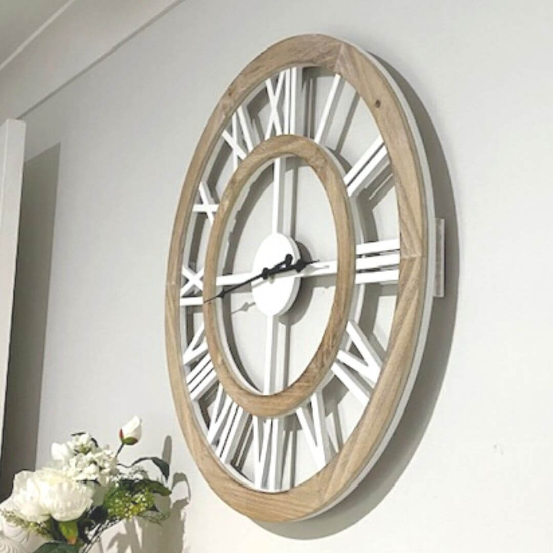 The 60cm big Hamptons Double Frame Floating Wall Clock features white numerals with a natural timber frame.